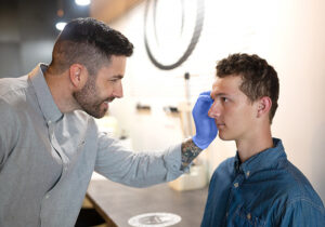 Ocularist fitting a patients artificial eye in Robina on Queensland's Gold Coast - Australia.